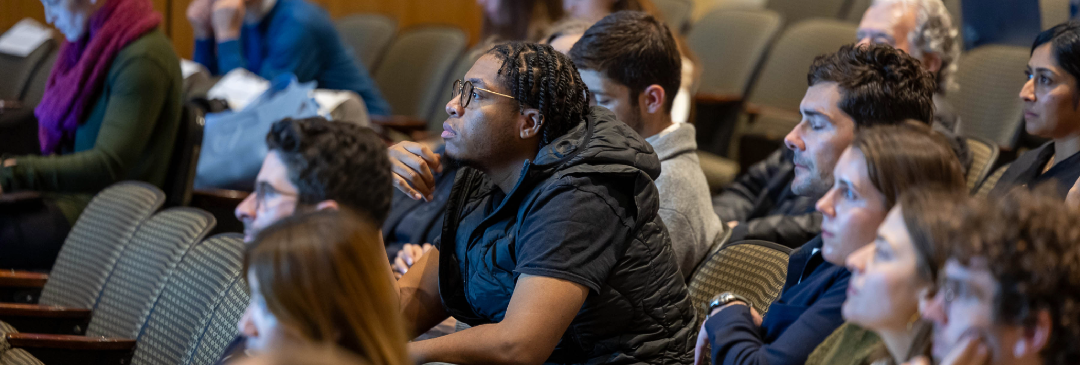 Student engaged in 135th Faculty Research Lecture given by Professor Dana Cuff