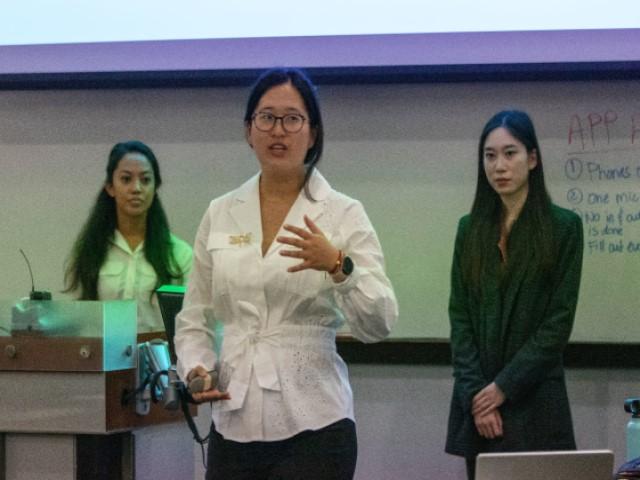 Sophia Li, center, explains her team’s yearlong policy analysis project, aimed at helping Los Angeles community clinics expand access to telemedicine.